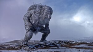 巨大的巨魔frozen-looking景观般笼罩着一个很小的人